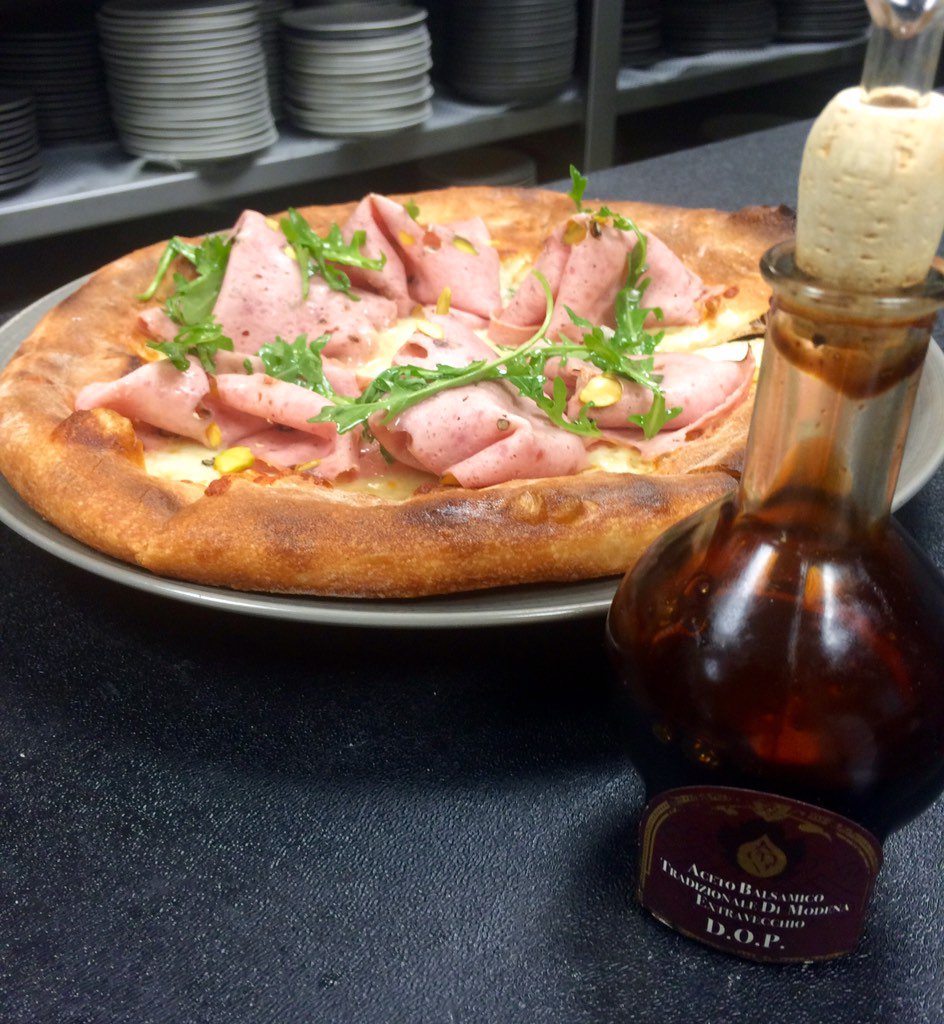 chefgresham's tweet photo. Mortadella pizza finish @Acetomodena 's traditional balsamic vinegar of #Modena @ The Kitchen by @WolfgangPuck https://t.co/CbwuoPYeON