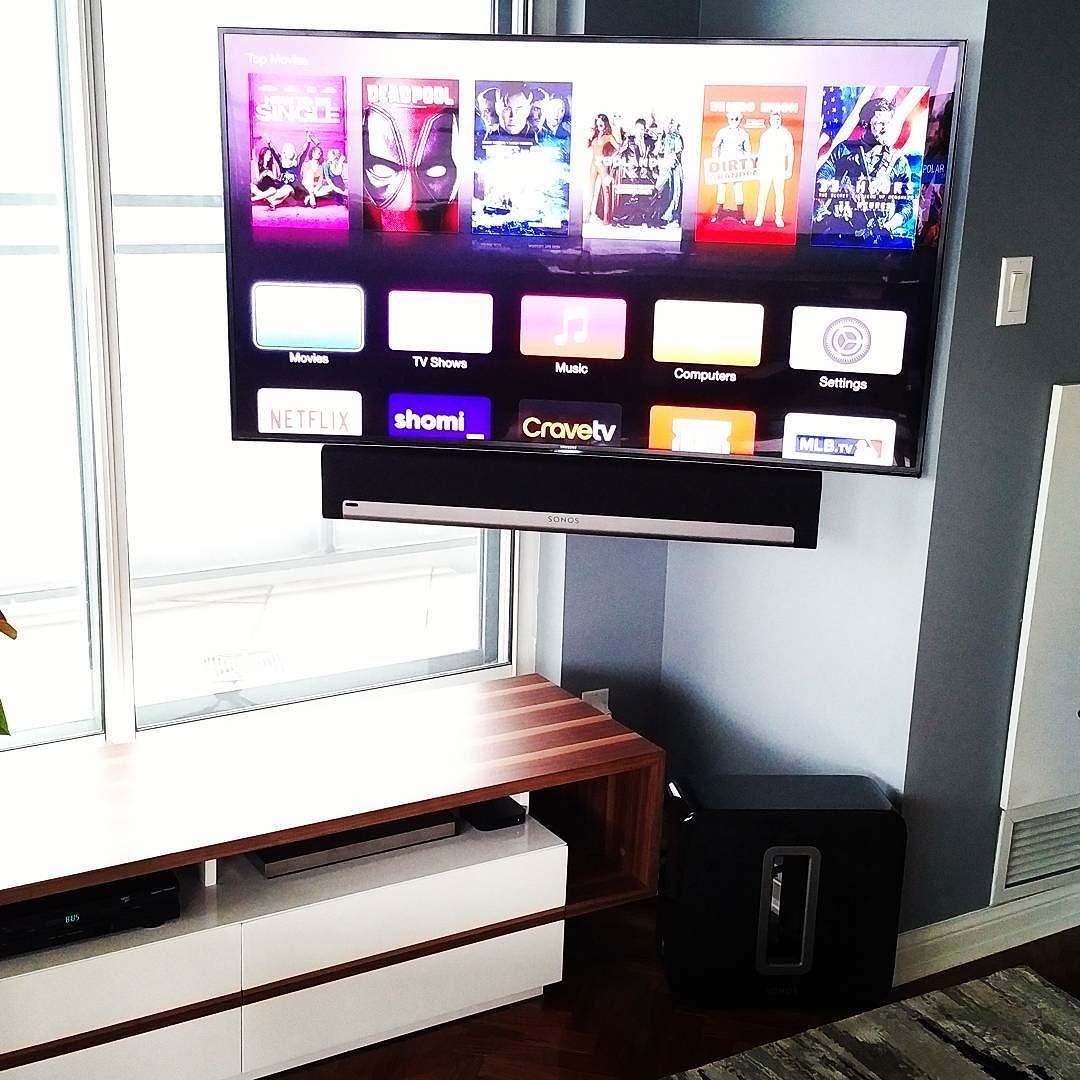 An 8 series #Samsung curved TV mounted in a corner using a #Chief #Thinstall series articulating mount.