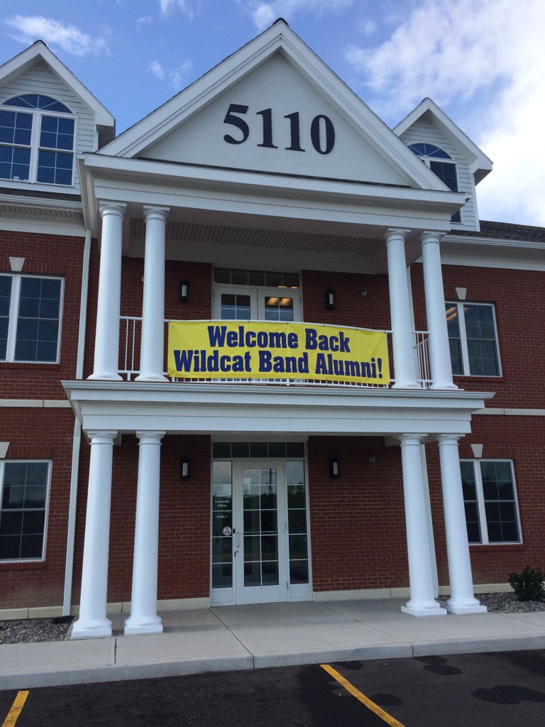 A warm welcome on the RealtyUSA building, across the street from the high school.