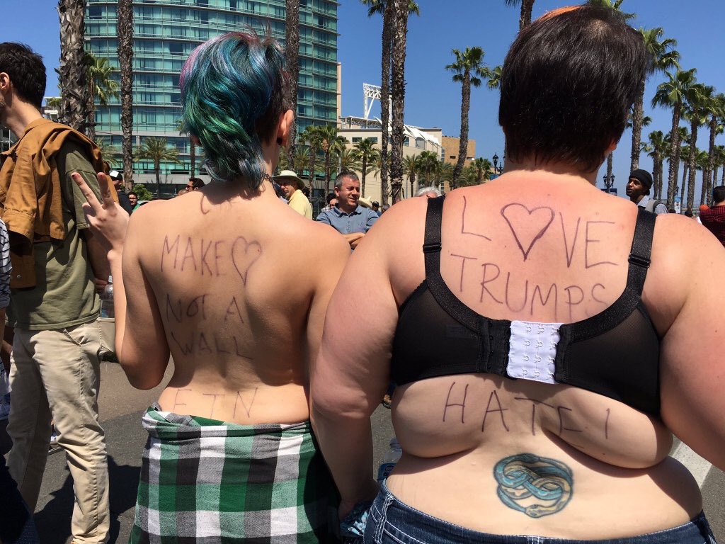 Progressives with back fat protest Trump in Fresno
