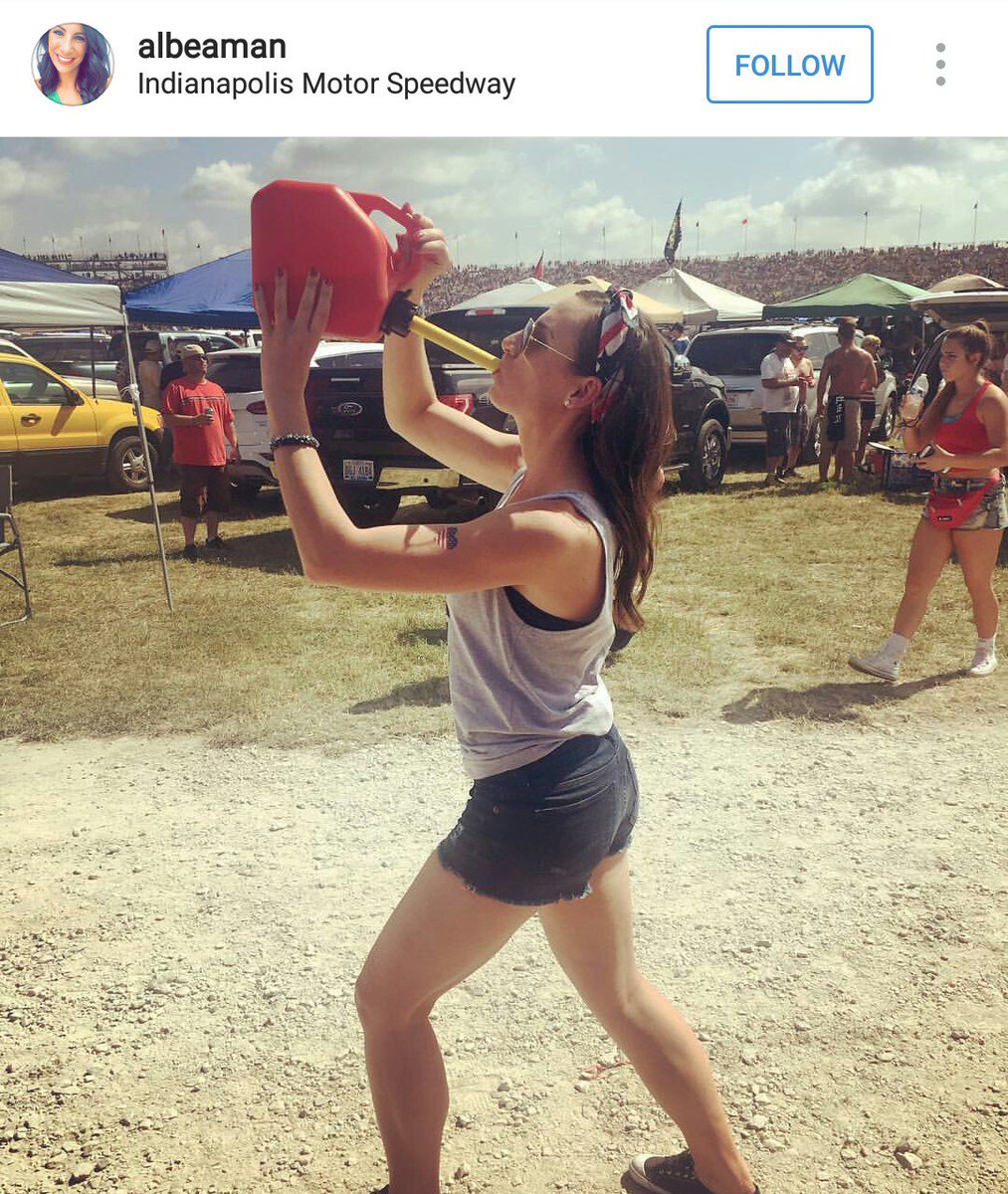 Indy500Pics's tweet photo. We invite you all to guess what this young woman is chugging out of this gas can. https://t.co/4EJUGxdYZp