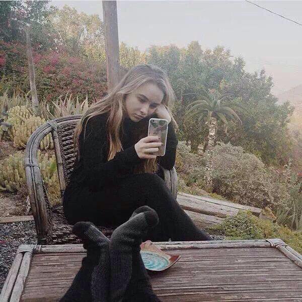 @SubduedHart Is always on her phone.