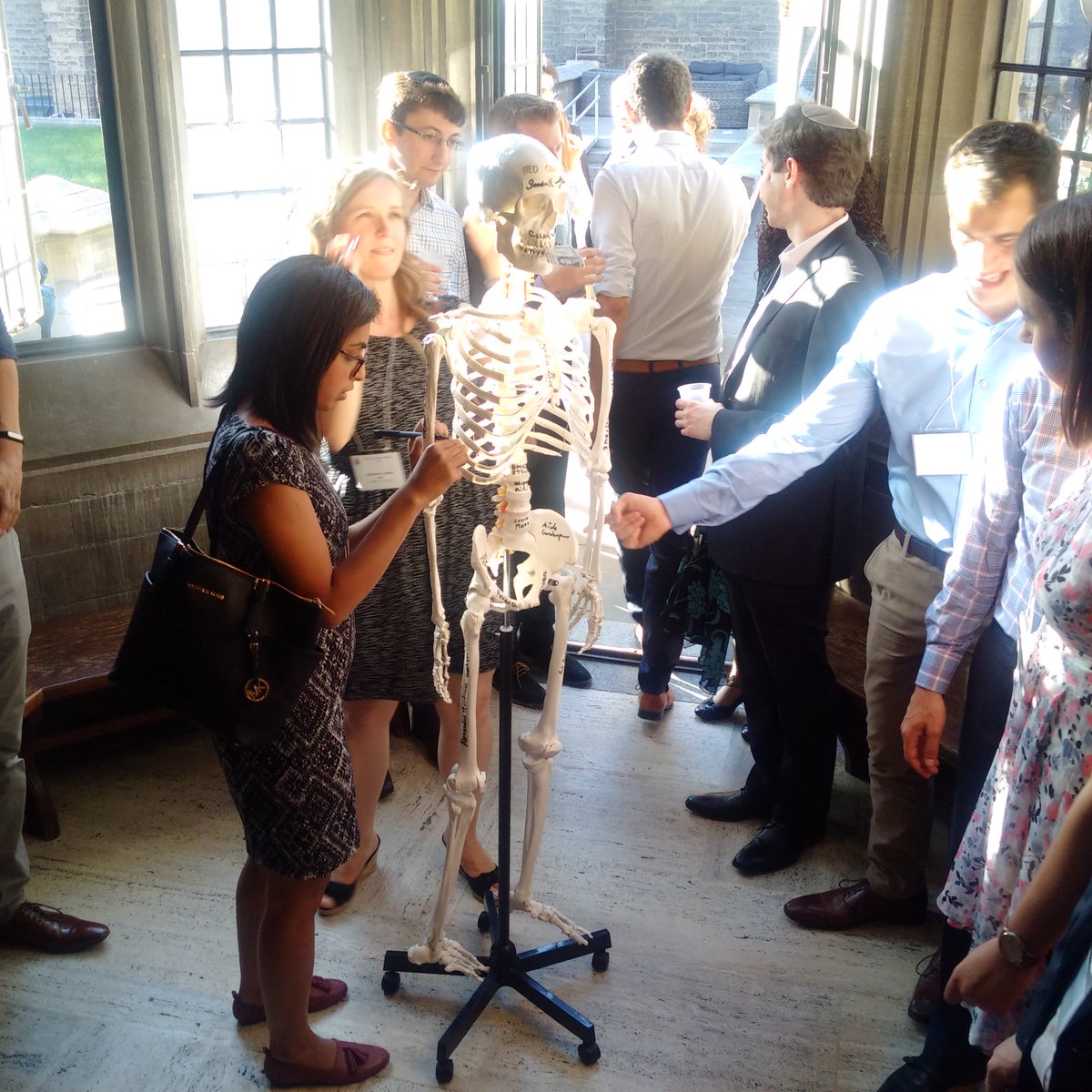 OHPSA's tweet photo. MD Class of 2016 gives Dr. Mike Wiley a signed skeleton as part of his award at the MAA Banquet. @uoftmedicine https://t.co/tiFLkynxQ2