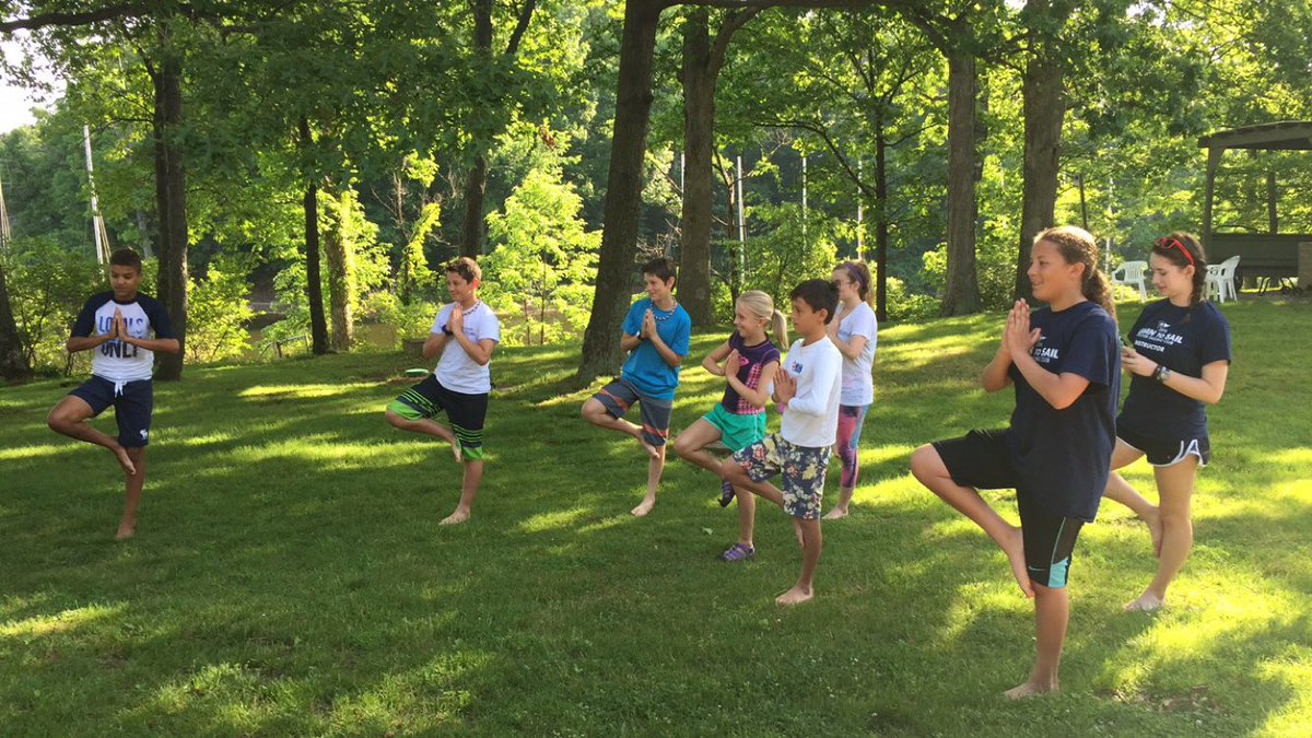 Nothing like a little early morning yoga to kick off Opti race camp this week!