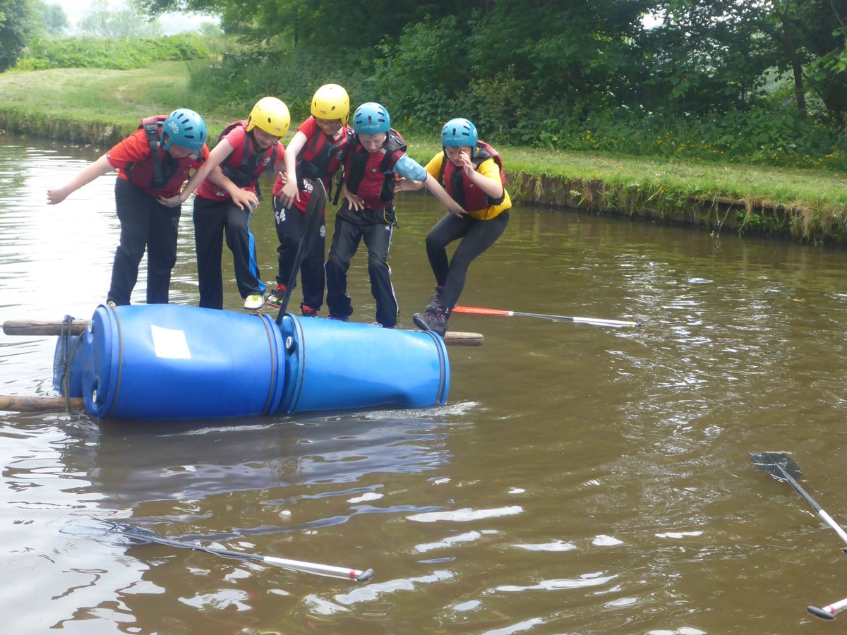 Pupils from St Marys primary school enjoying raft building in the sunshine. I wonder what happened next?!