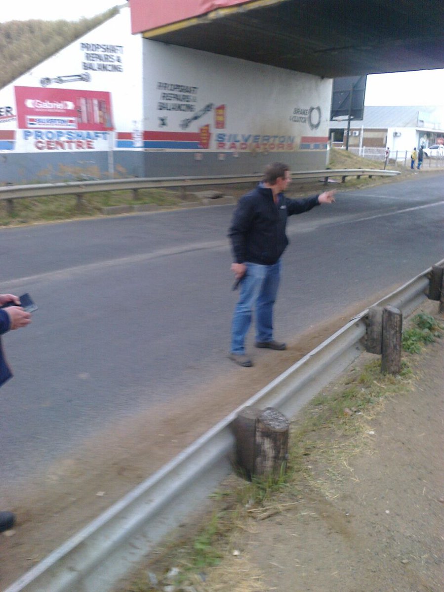 mmokausem's tweet photo. @EFFSouthAfrica @EffNorthwest At gunpoint, this white fellow removes and destroys EFF Posters in Vryburg North West https://t.co/qsyEn6IM8C