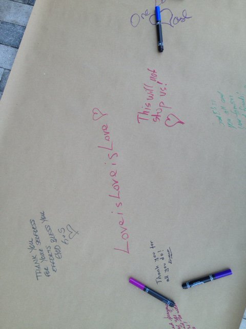 Outside the @DrPhillipsCtr in #Orlando where people are signing a banner, leaving flowers for shooting victims https://t.co/yAewCbEgOH