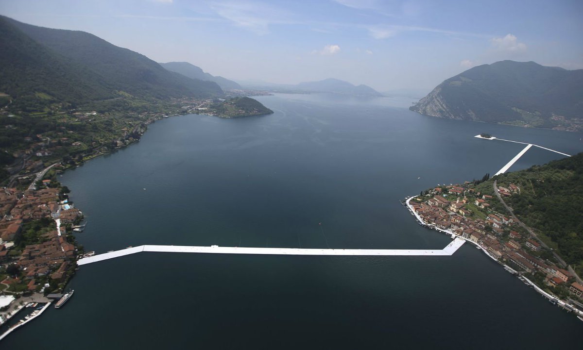SaatchiArt's tweet photo. Christo's new installation, opening late June, will allow visitors to cross Lake Iseo on 220k poly-ethylene cubes. https://t.co/rEEQ5D6sxm