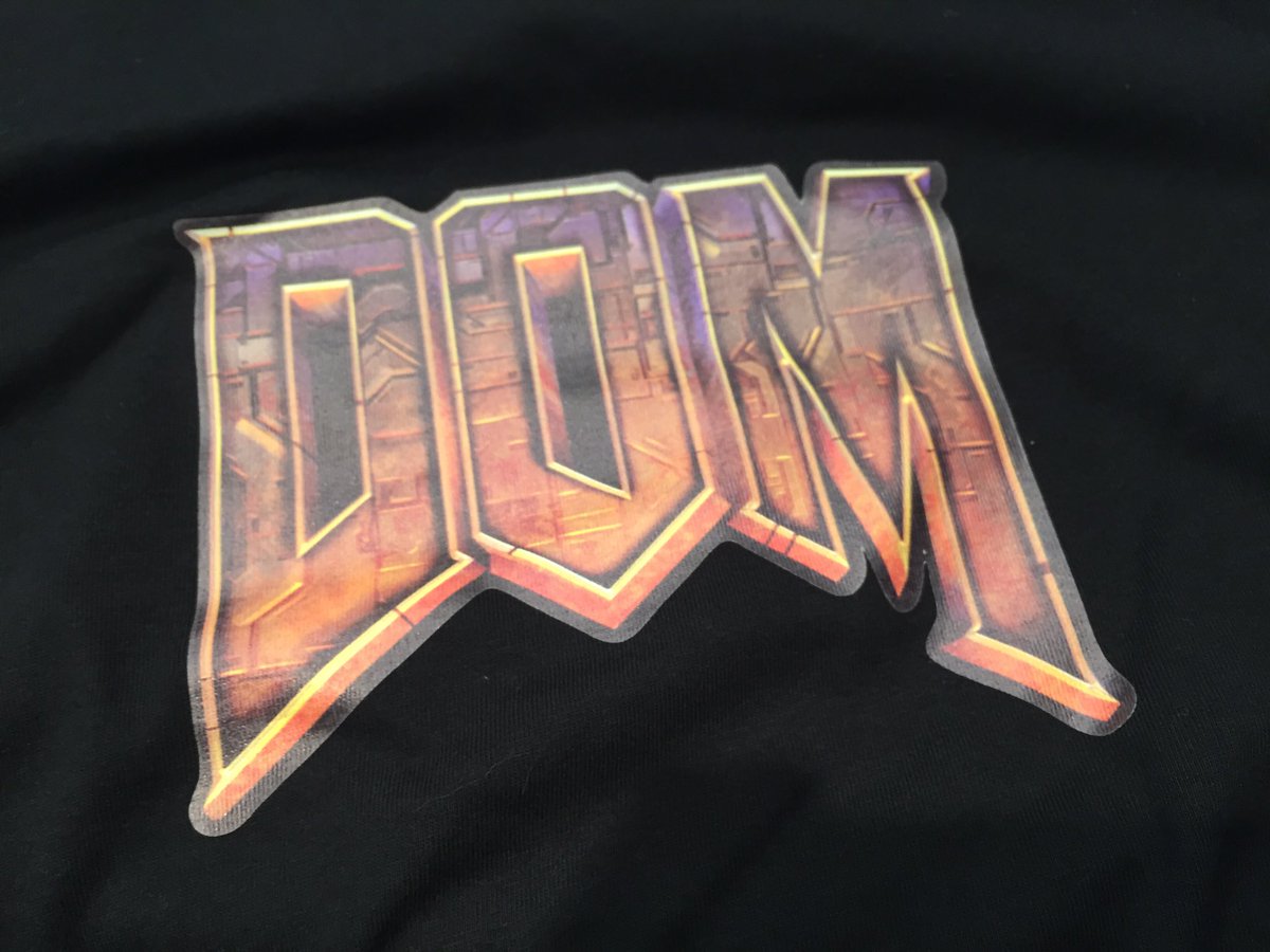 Front of t-shirt with DOM spelled in the style of DOOM.