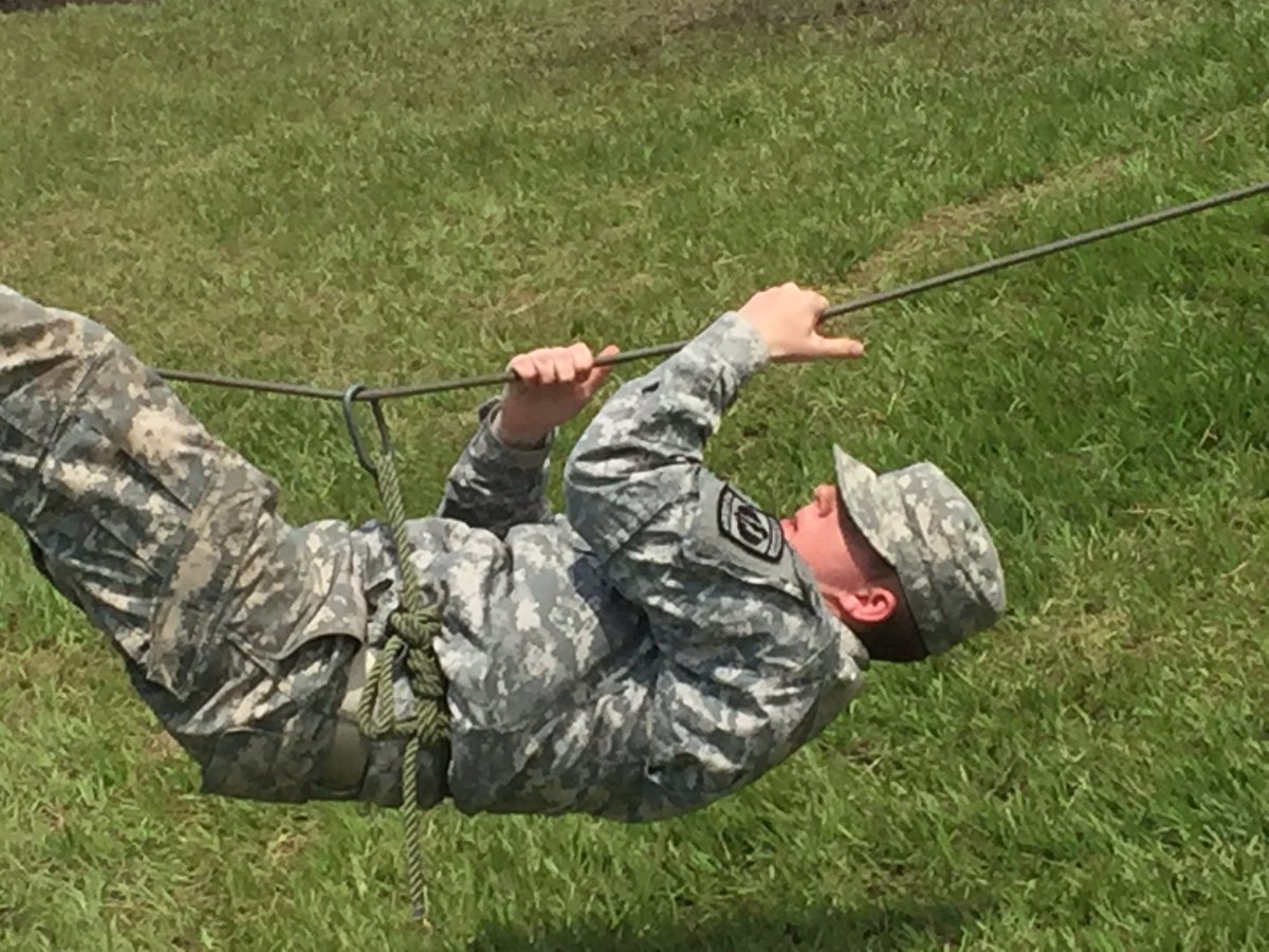 Cadet Jacob Hansen climbing across the one rope bridge at our Junior Cadet leadership camp