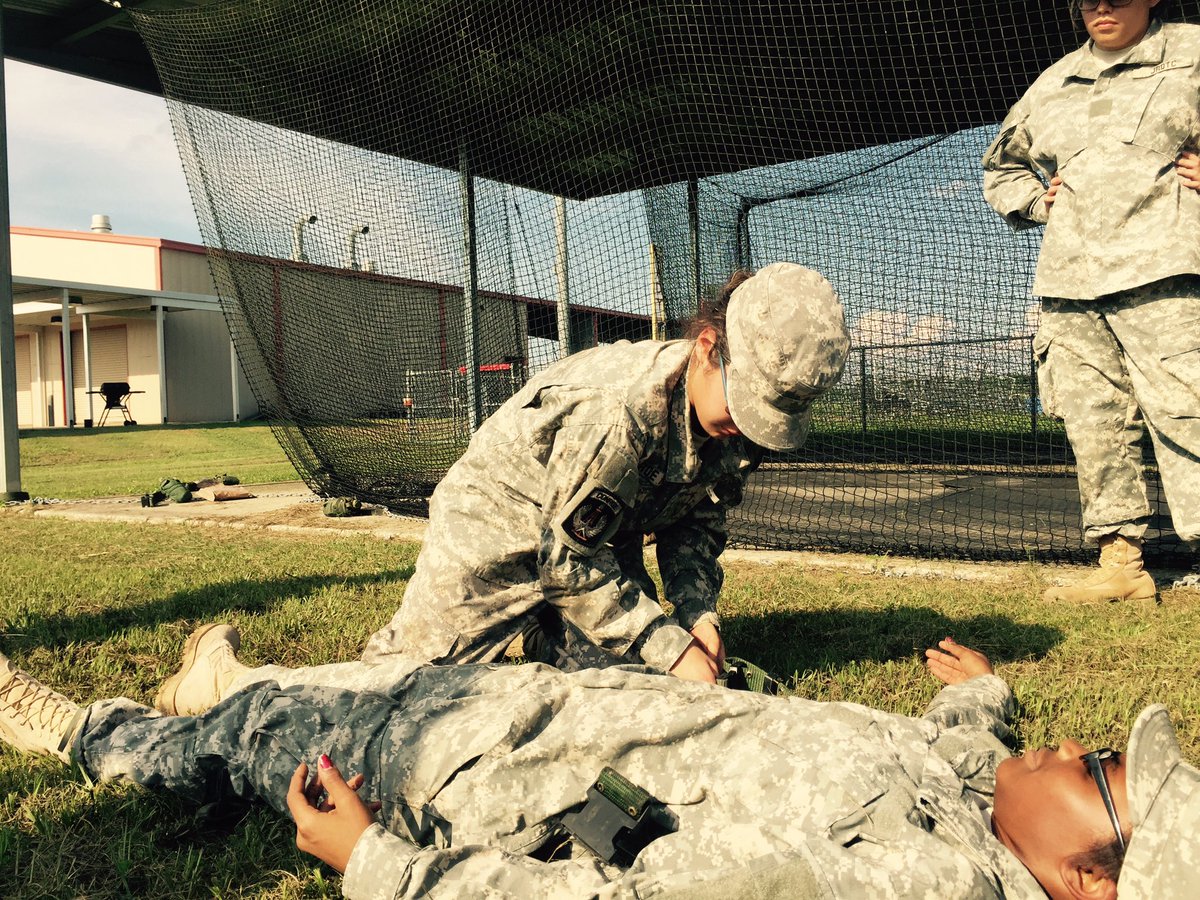 Our cadets learning first aid tips. This one is called the pistol belt carry.
