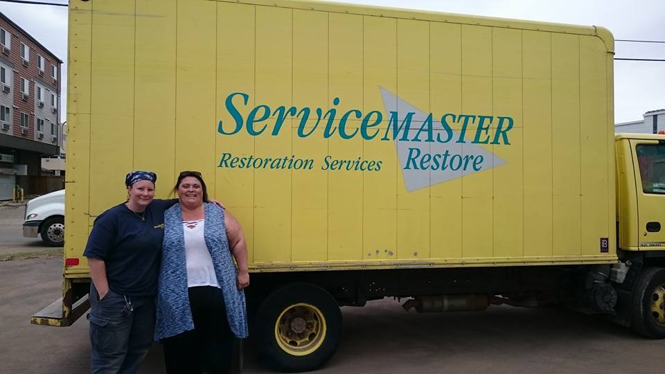 Kelly from our office at the Fort Mac food bank donating $1000 and a truck full of food!