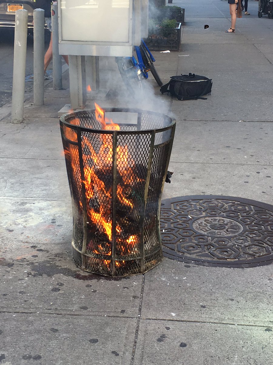 Not everyday you see this on the corner. Melting pot? Yes. Burning trash  can? Not so much.