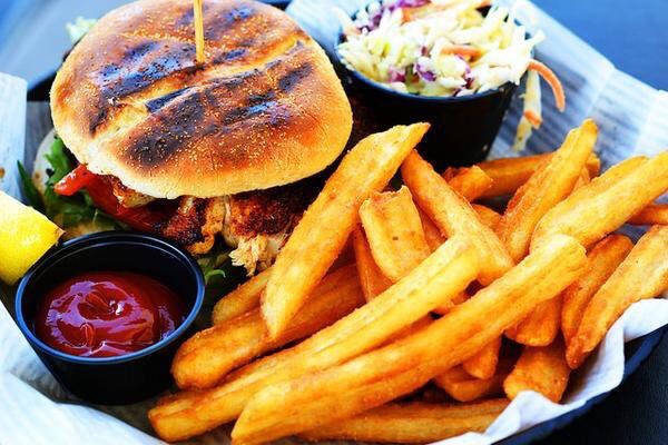 Blackened chicken sandwich and fries