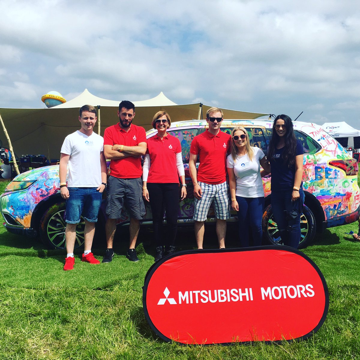 The @Q102MoreMusic crew helping us today @tatts_ireland face painting and more fun in the #Mitsubishi picnic area...