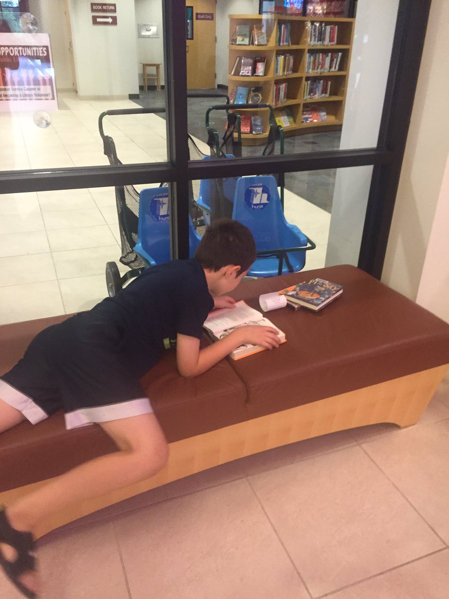 lynellewolfe's tweet photo. Didn't even leave the library b4 he started reading. 😂 #getcaughthurst #checkouthurst #hebreads https://t.co/XghvONF78V