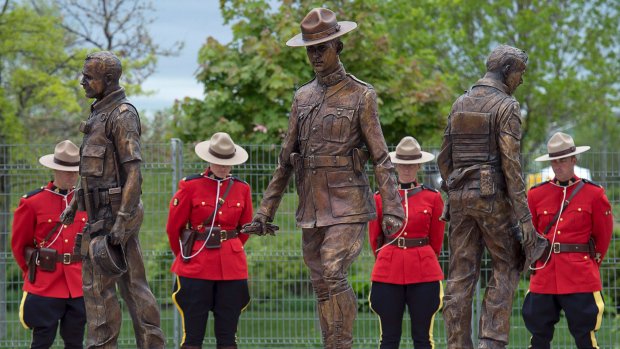 CTVNews's tweet photo. Monument unveiled for RCMP officers killed in Moncton shooting https://t.co/Xj6gY4H96M https://t.co/SM40kRMSJU