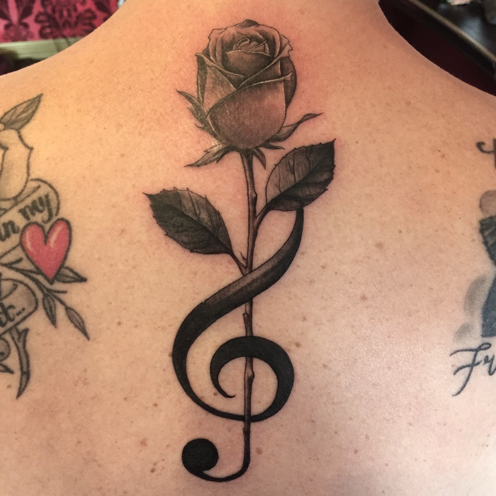 High Voltage Tattoo on X: "Super cool treble clef/rose tattoo by the super cool @artofkevinlewis. ❤️❤️ https://t.co/UdomgYjjL7" / X