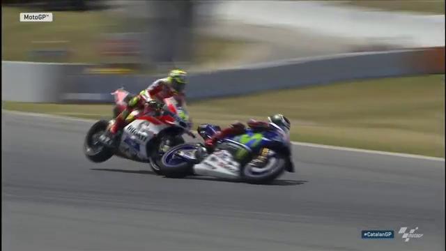 MotoGP's tweet photo. .@andreaiannone29 collides with @lorenzo99! Both are out of the race!

Fortunately both up and walking. #CatalanGP https://t.co/wPzGfEtuke