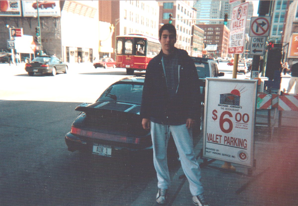 incolas's tweet image. April 1996, myself in front of Michael Jordan's car, in front of his restaurant in Chicago #datplate #ultimatefanboy