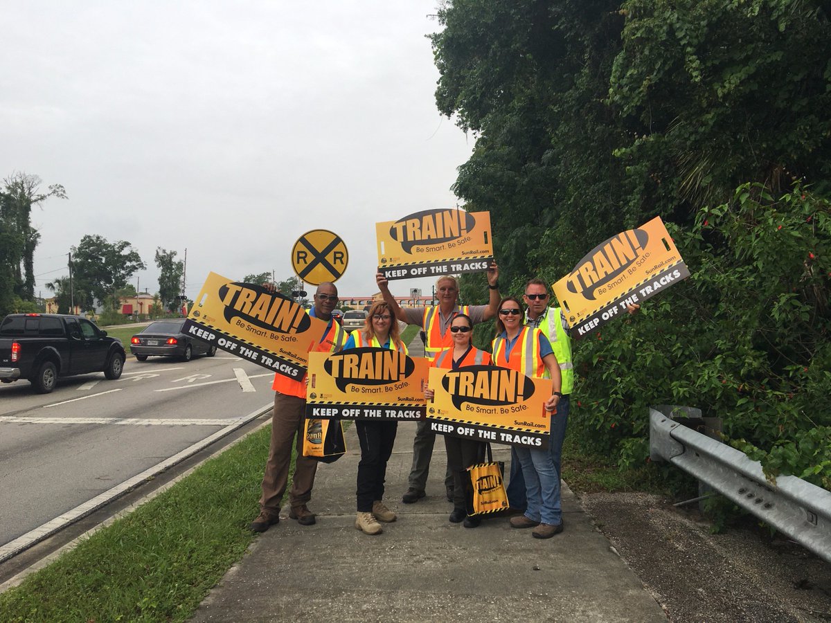 RideSunRail's tweet photo. Law enforcement &amp; volunteers @ crossings this week. Stay behind the white line &amp; off RR tracks! #SunRailSafety https://t.co/2HqM5m9197