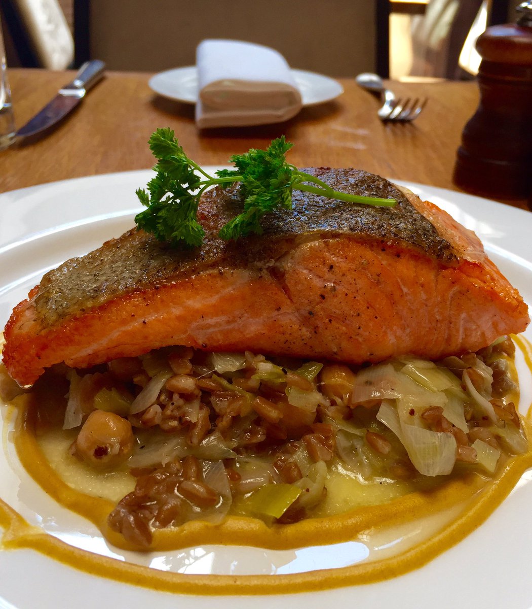 Arctic Char is pan roasted and served with wilted leeks, toasted faro &amp; a Dijon emulsion.