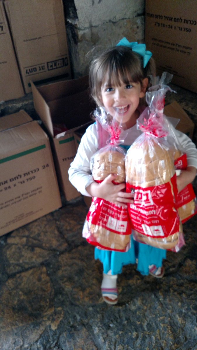 breadforisrael's tweet photo. The children of #Haifa got bread. Tonight they will go to sleep on a full stomach. #israel #feedisrael https://t.co/MHbO1xpAyn