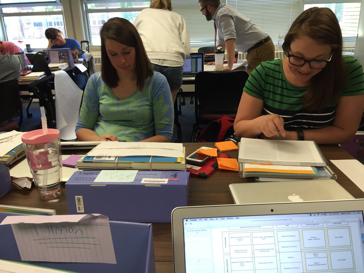 Mrs. Fehl and Mrs. Manuel reading about how to teach reading...go figure!