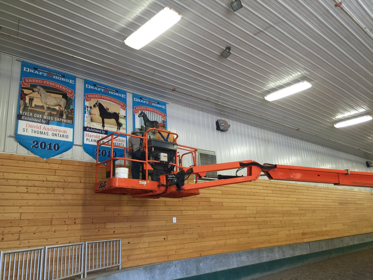 mnstatefair's tweet photo. We hung 18 banners of past draft horse halter supreme champions in AgStar Arena! #FairgroundsInSummer https://t.co/QiSwdFU2Jp