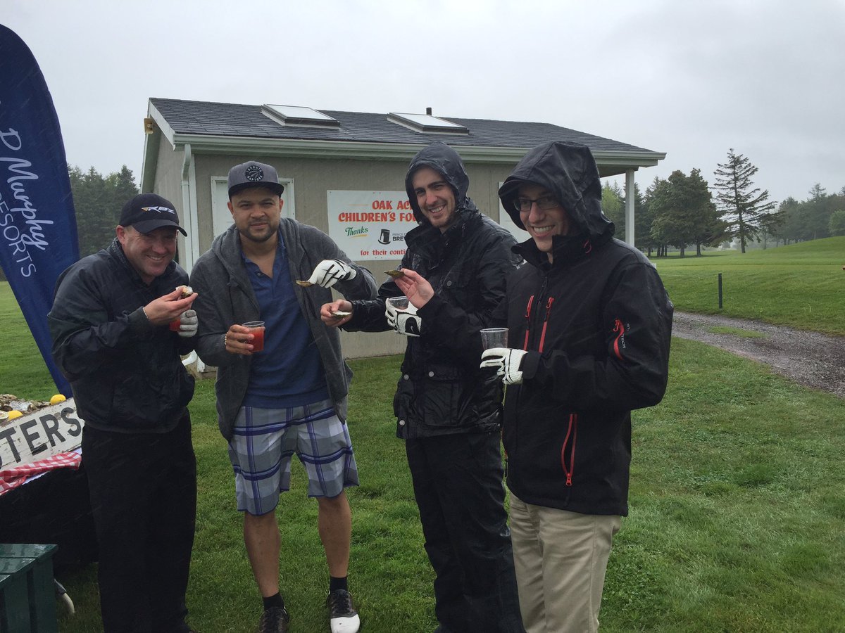 Tebey's tweet photo. It's pissing rain here in #PEI, but that won't keep us from enjoying fresh oysters and raising money for kids 👍🏻 https://t.co/if0ypMvLYf