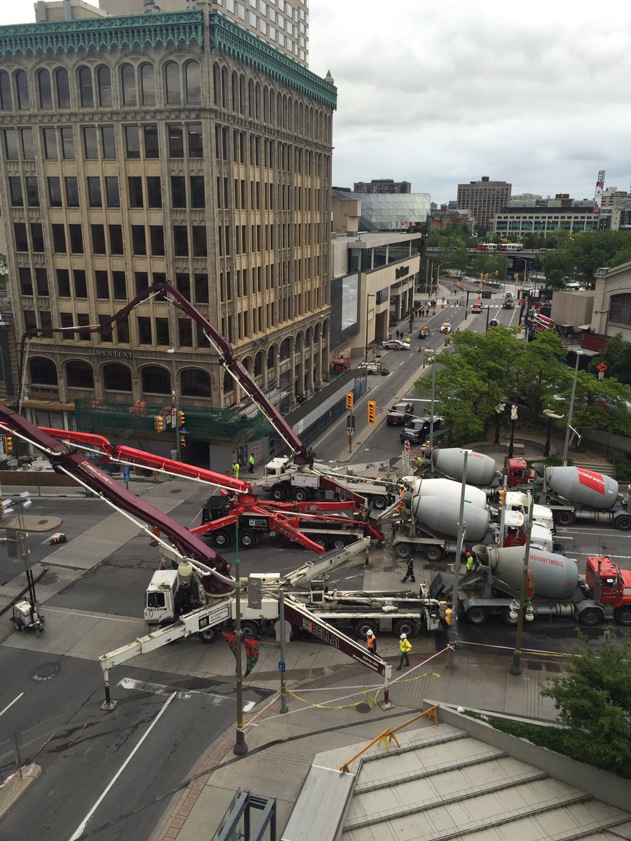 Great picture <a href="/kaymayfield/">Kay Mayfield</a> of all the cement mixers and great teamwork happening in downtown #Ottawa.  #sinkhole