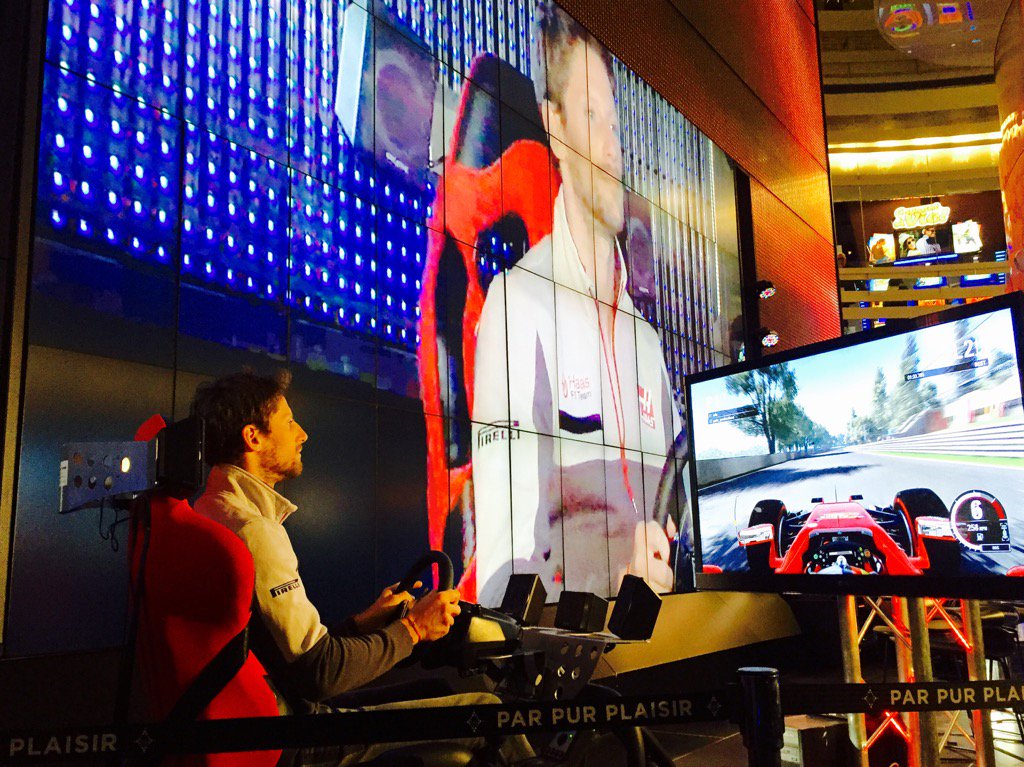 HaasF1Team's tweet photo. .@RGrosjean battling it out on track against @ValtteriBottas at the #CanadianGP Fan Forum this evening. #BigScreen https://t.co/7NRjvpjAzn