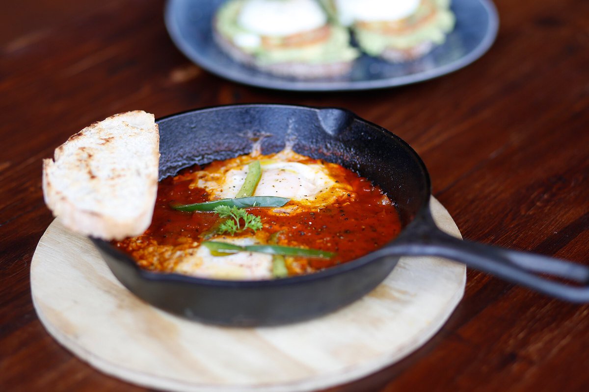 WolvesCafe's tweet image. Have you tried our Shakshuka? It comes with two eggs which sit in a fragrantly rich red pepper and tomato sauce.