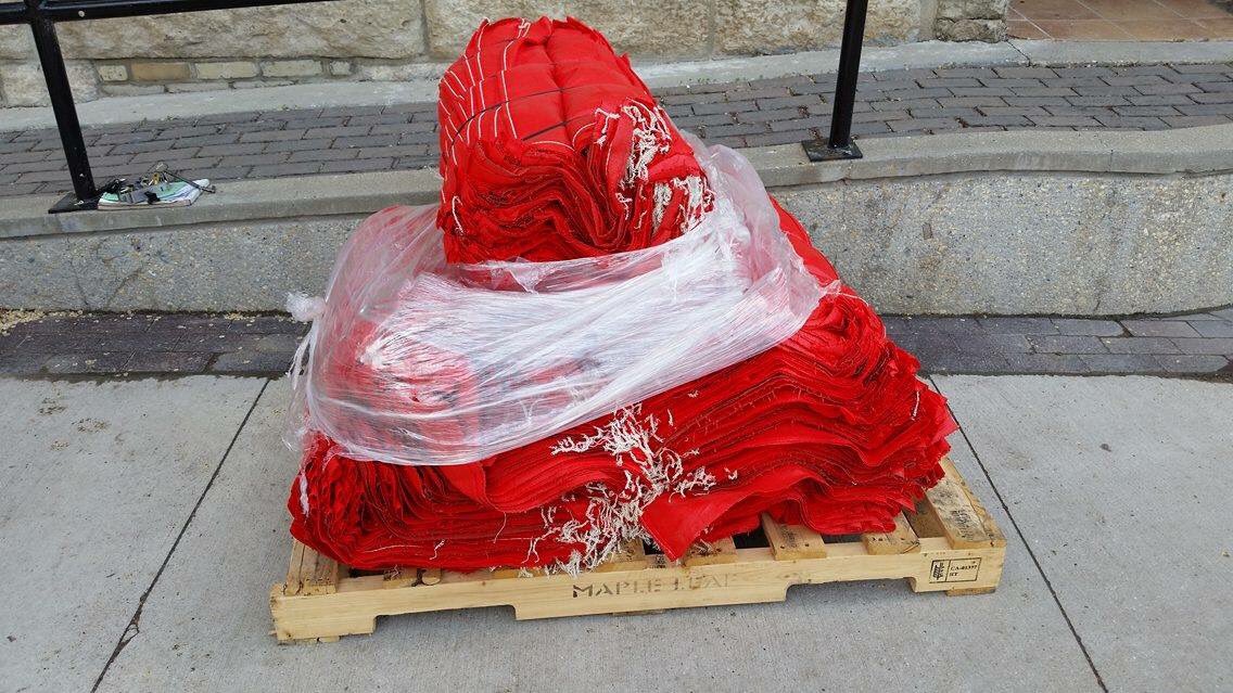 OPEN_SK's tweet photo. 1500 RED sand bags have arrived for our #YWG #CoolGardens2016 install later in June. thx @storefrontMB1, can't wait! https://t.co/5UGQb8322u