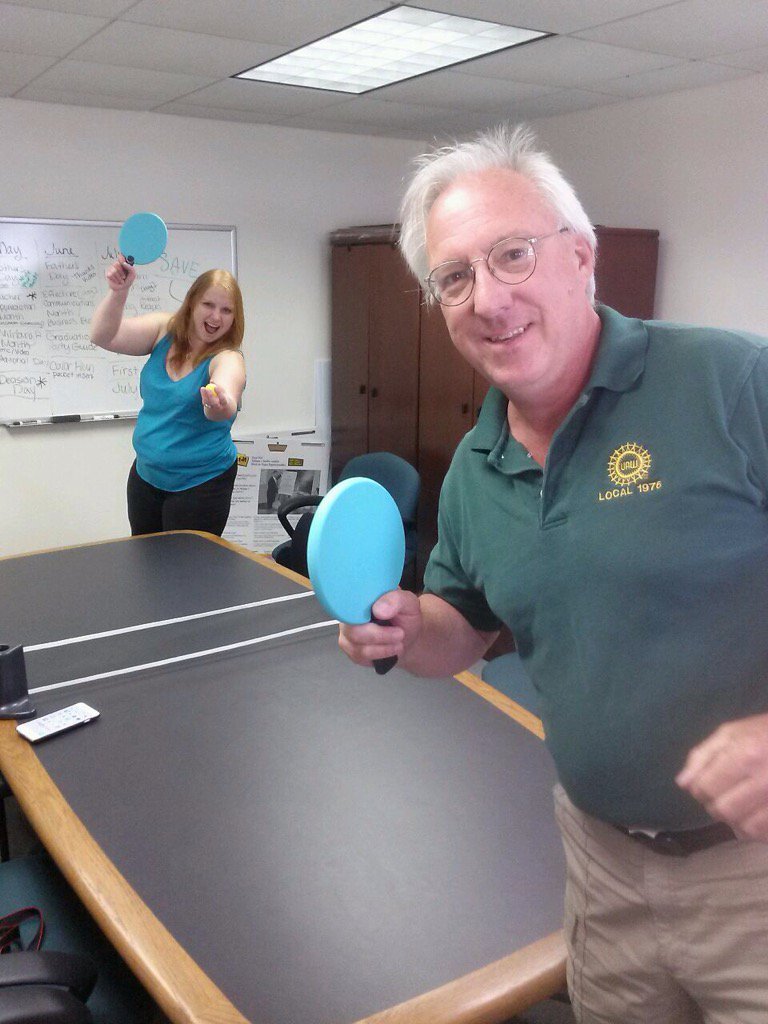 TedCoutilish's tweet photo. #TRUEMU Marketing Office brainstorming session evolves into ping-pong game. At least the paddles are green! #EMU https://t.co/JBEPLtpsft