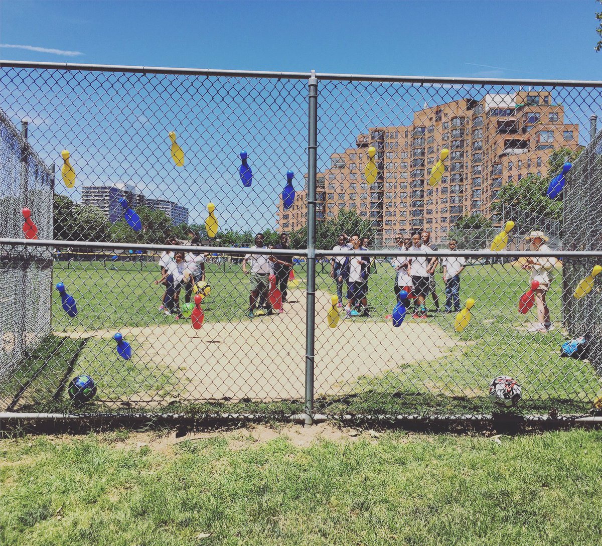 Mr. Warren's class at the soccer station, trying to knock down the pins with well-placed kicks. #phled