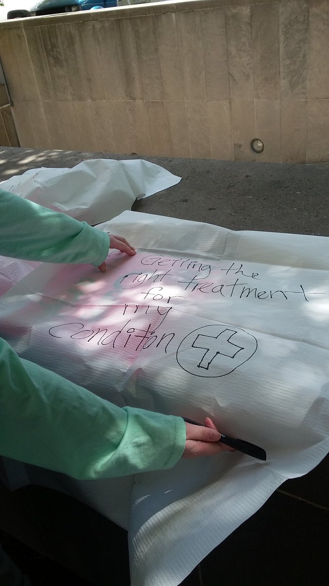 justice4worker's tweet photo. Injured workers write what healthcare means on hospital gowns during our demonstration in Toronto! @jwjnational https://t.co/91oQElg4UO