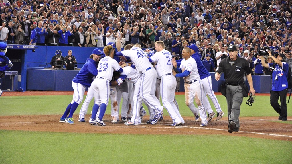 BlueJays's tweet photo. .@Encadwin + #Walkoff = mob at home plate. #OurMoment https://t.co/8Bq6jx4tYF