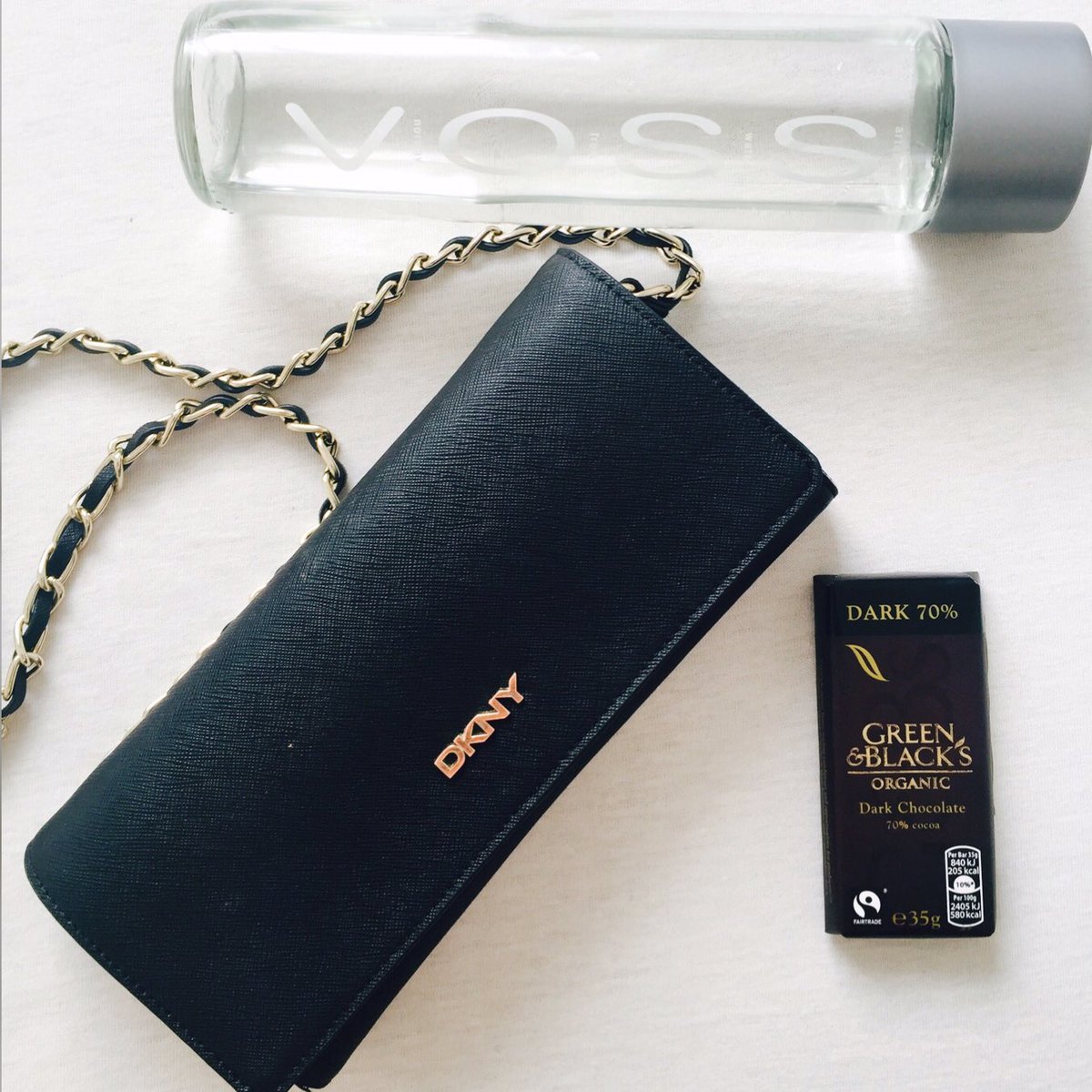 My snack on this Saturday Green &amp; Black's organic dark chocolate #darkchocolate #snacktime #dkny #vosswater