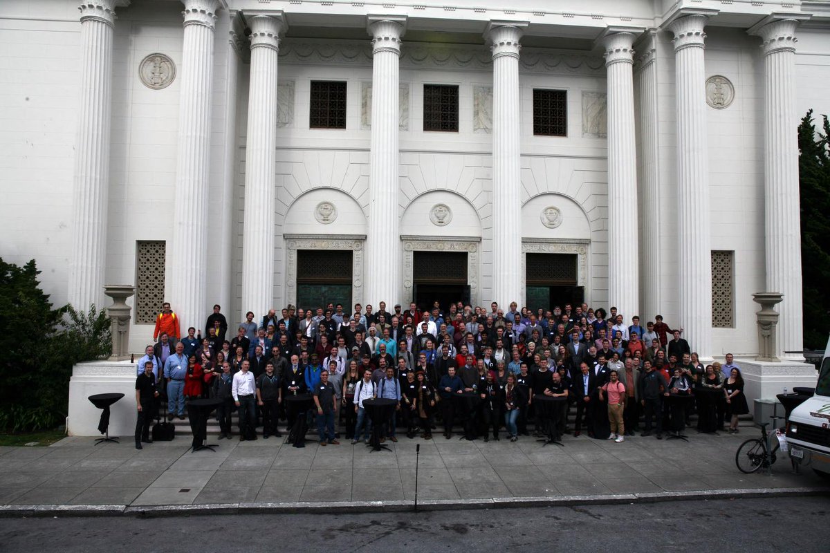 Group photo of Decentralized Web Summit attendees in front of the Internet Archive building.