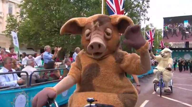 Animals riding bikes - symbolising Her Majesty's love of animals