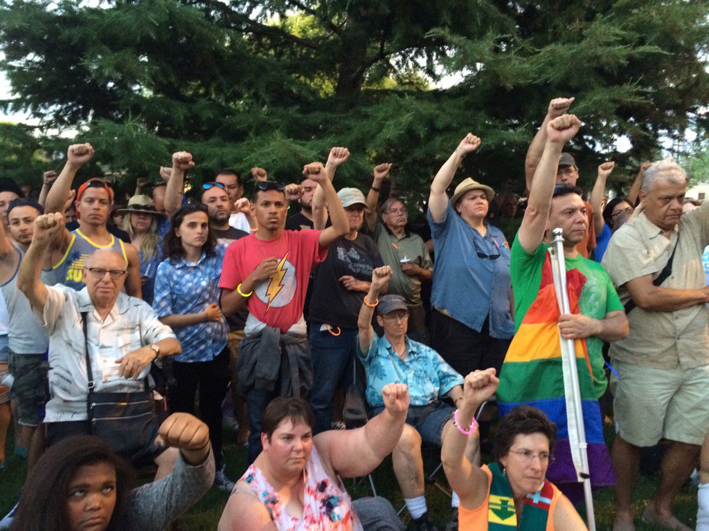 CandaceKRQE's tweet photo. #ABQ Muslim leaders ask crowd to raise fists in solidarity at vigil for Orlando victims. https://t.co/lG7Okooh8x