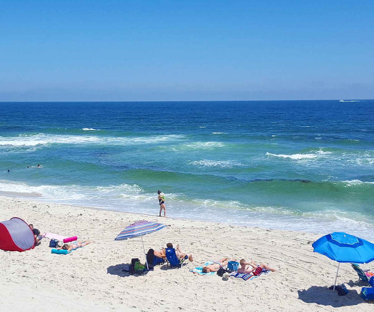 Great weather &amp; warmer water! Visible in this photo are rip currents though. Only swim in the presence of guards.