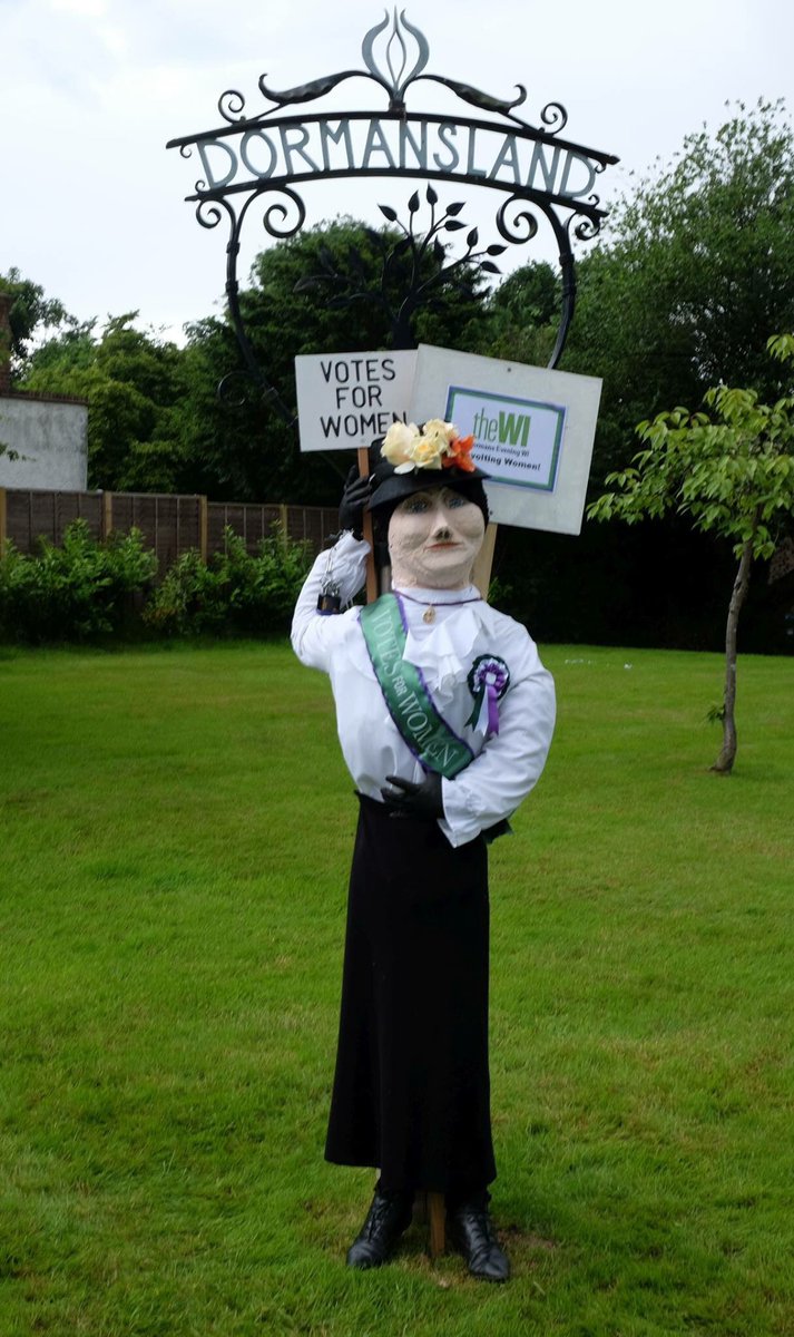 Dormans Evening WI's 100-year-old heroine has arrived &amp; chained herself to the village sign #DormanslandCarnival