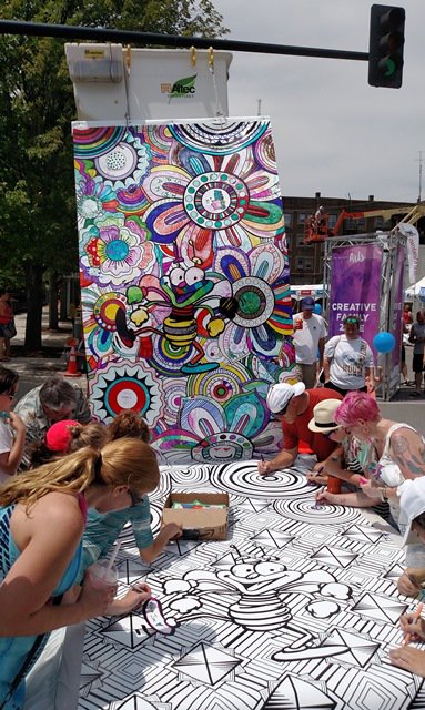 MidAm_EnergyCo's tweet photo. Who’s having more fun, the kids or the adults? Come help us finish coloring this masterpiece. #BOOMArt #DMAF2016 https://t.co/lWWMXsl3uQ