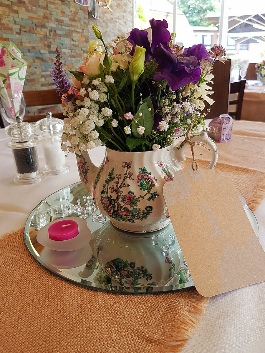 CupsLoveSaucers's tweet photo. Teapots aren't just for Tea! Lovely centrepieces from yesterday's function. https://t.co/J0JZ8ztdoC