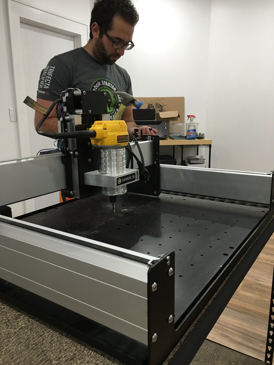 BloxMade's tweet photo. Our local repair man (and Chief Production Officer) hard at work, when all else fails grab the hammer! #startuplife https://t.co/SVpIb8LMka