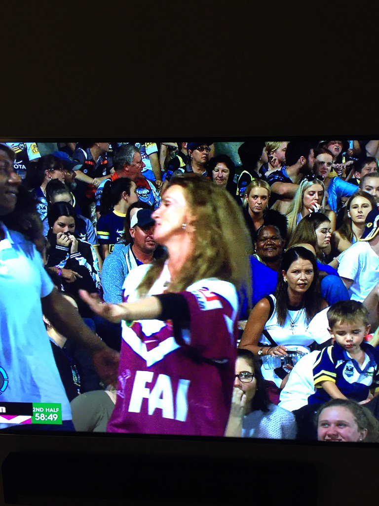 Haha chick in the background not really happy with this manly supporter dancing!