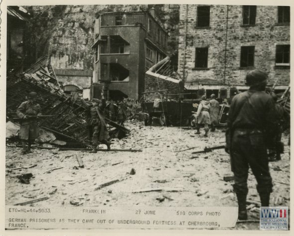 WWIImuseum's tweet photo. #OTD in 1944, US troops liberate Cherbourg, France. Here are Germans prisoners coming out of a bunker on 6/27/1944. https://t.co/afVmGChnfY
