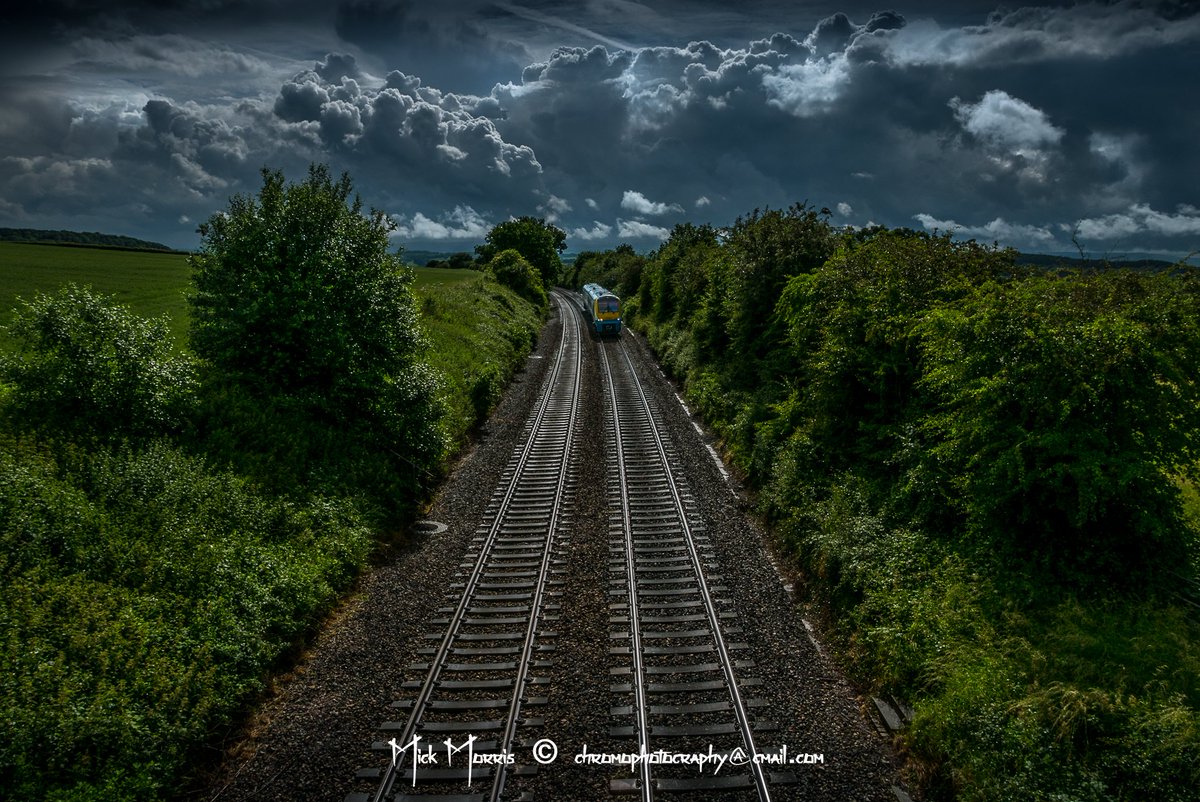 bbcmtd's tweet photo. Clouds over the tracks at #Wormbridge in #Herefordshire this afternoon. Thanks for this beautiful pic Mick Morris. https://t.co/UE4zrqtY5u